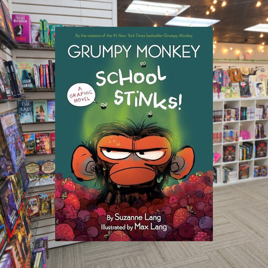 Grumpy Monkey School Stinks!: A Graphic Novel by Suzanne Lang — actual cover on The Perk bookstore background