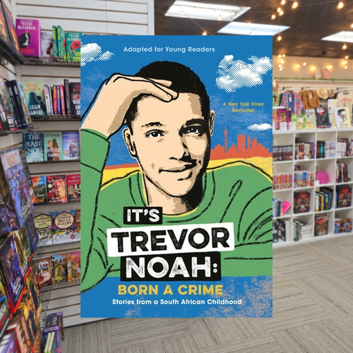 It's Trevor Noah: Born a Crime: Stories from a South African Childhood by Trevor Noah — actual cover on The Perk bookstore background