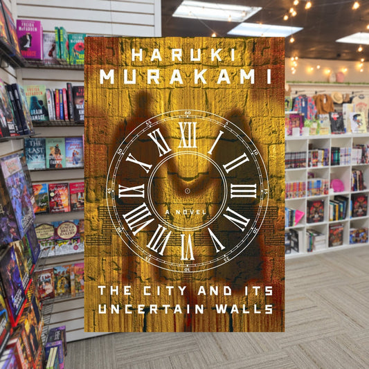 The City and Its Uncertain Walls — actual cover on The Perk bookstore background