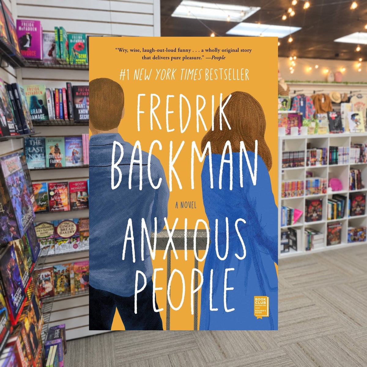 Anxious People by Fredrik Backman — actual cover on The Perk bookstore background