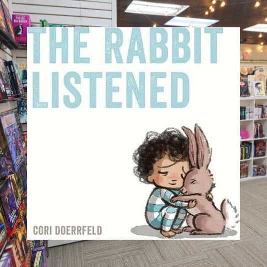 The Rabbit Listened by Cori Doerrfeld — actual cover on The Perk bookstore background