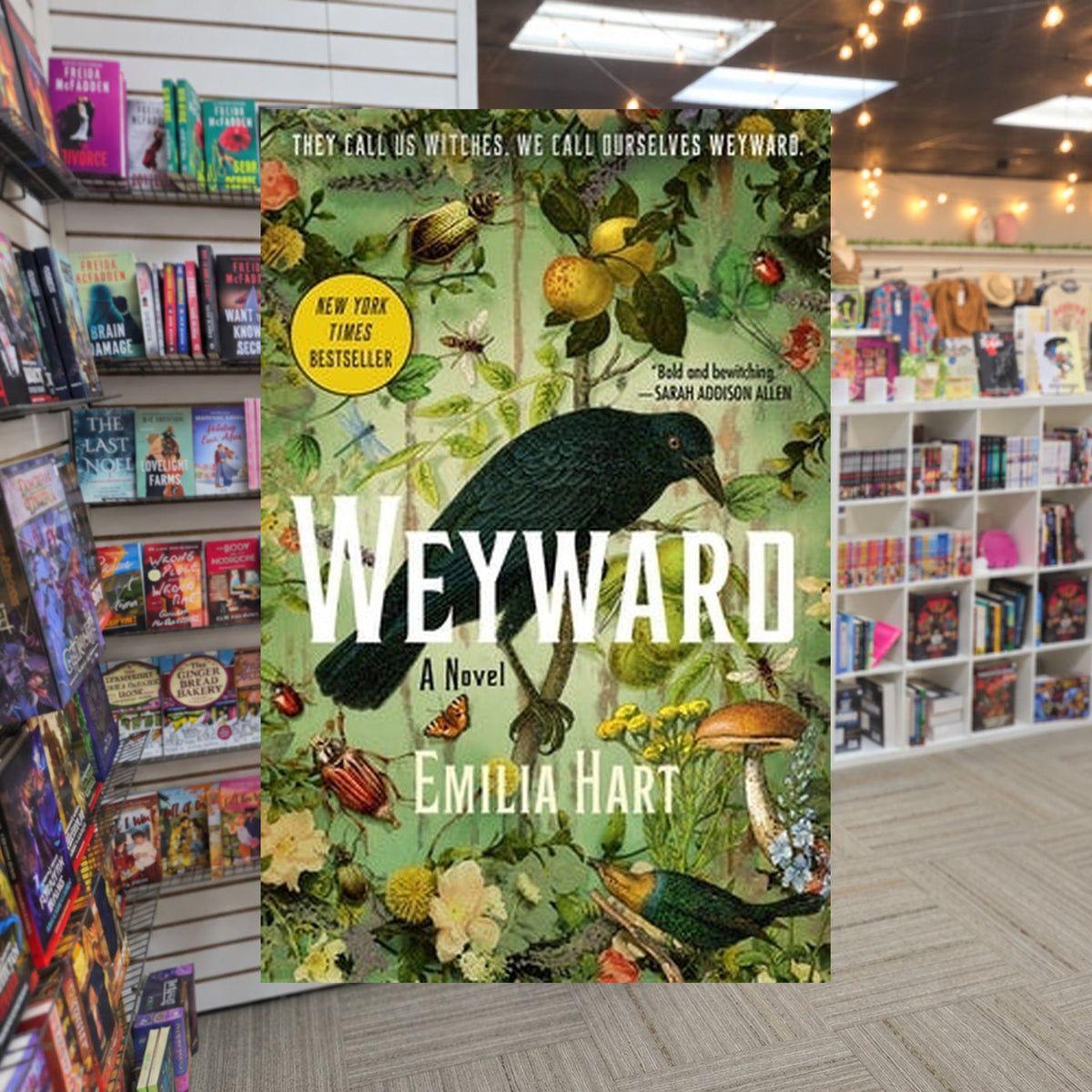 Weyward by Emilia Hert — actual cover on The Perk bookstore background