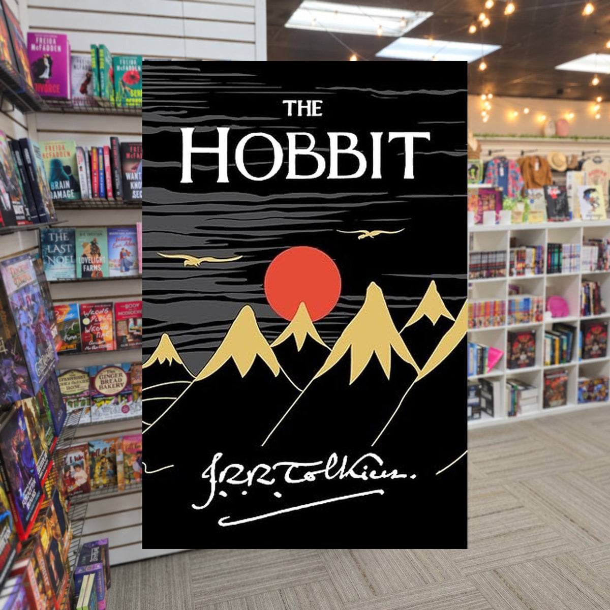 Middle Earth #0: The Hobbit by J.R.R. Tolkien — actual cover on The Perk bookstore background