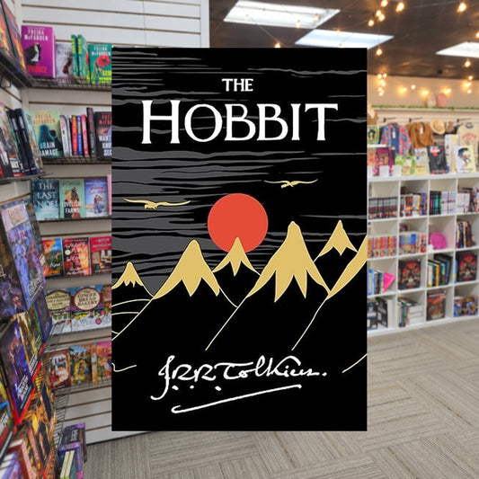 Middle Earth #0: The Hobbit by J.R.R. Tolkien — actual cover on The Perk bookstore background