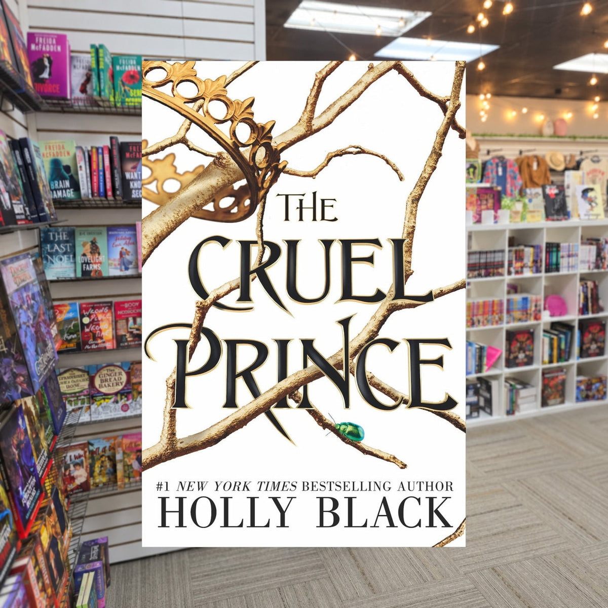 The Folk of the Air #1: The Cruel Prince by Holly Black — actual cover on The Perk bookstore background