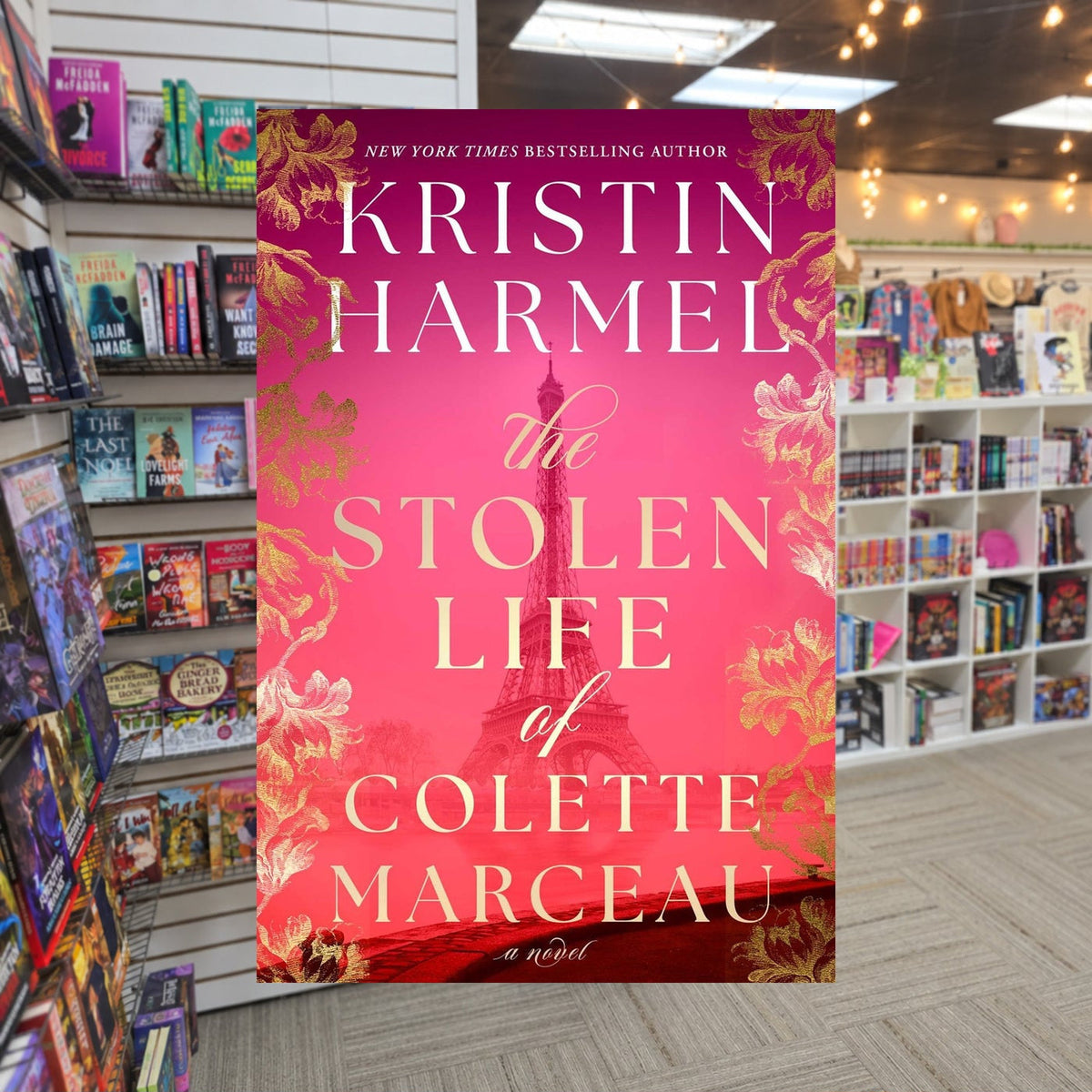 The Stolen Life of Colette Marceau by Kristin Harmel — actual cover on The Perk bookstore background