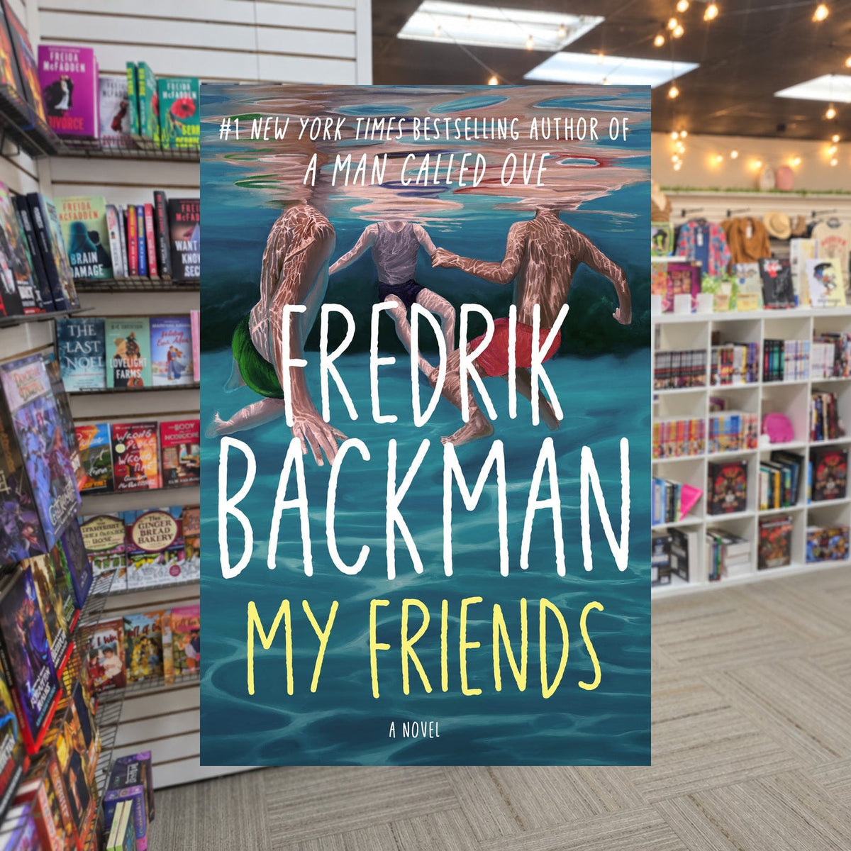 My Friends by Fredrik Backman — actual cover on The Perk bookstore background