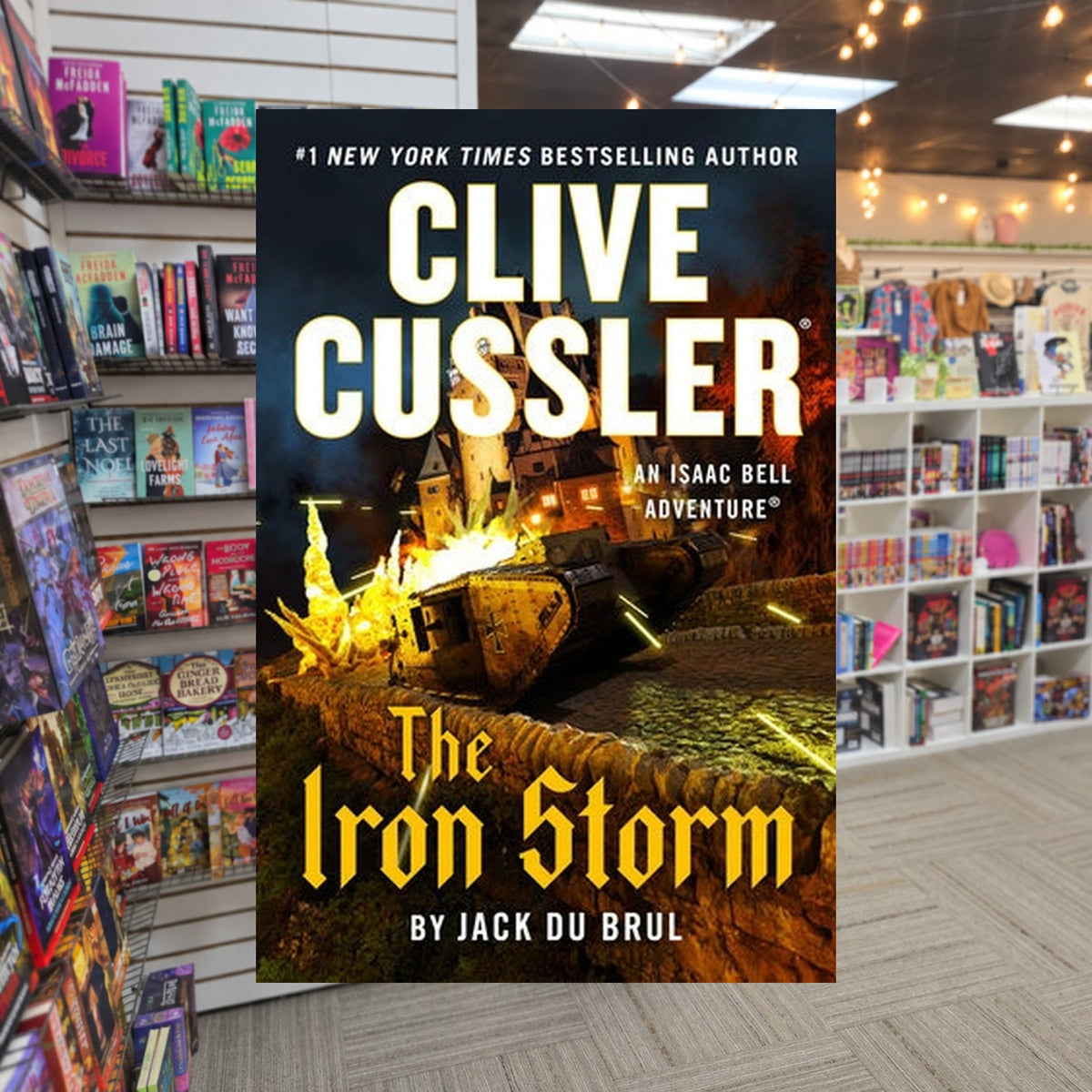 Isaac Bell #15: The Iron Storm by Jack Du Brul, Clive Cussler — actual cover on The Perk bookstore background