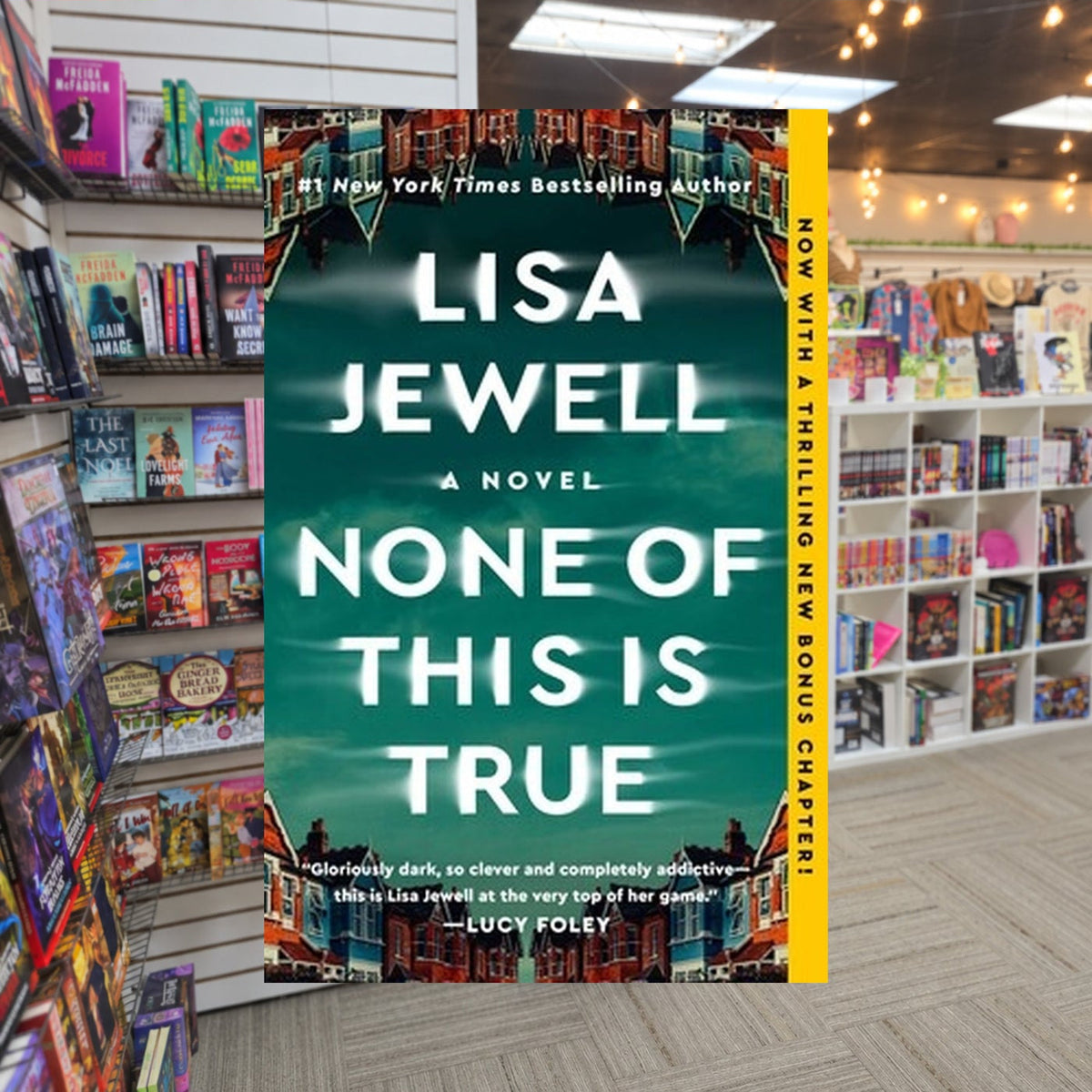 None of This Is True — actual cover on The Perk bookstore background