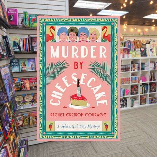 Murder by Cheesecake by Rachel Ekstrom Courage — actual cover on The Perk bookstore background