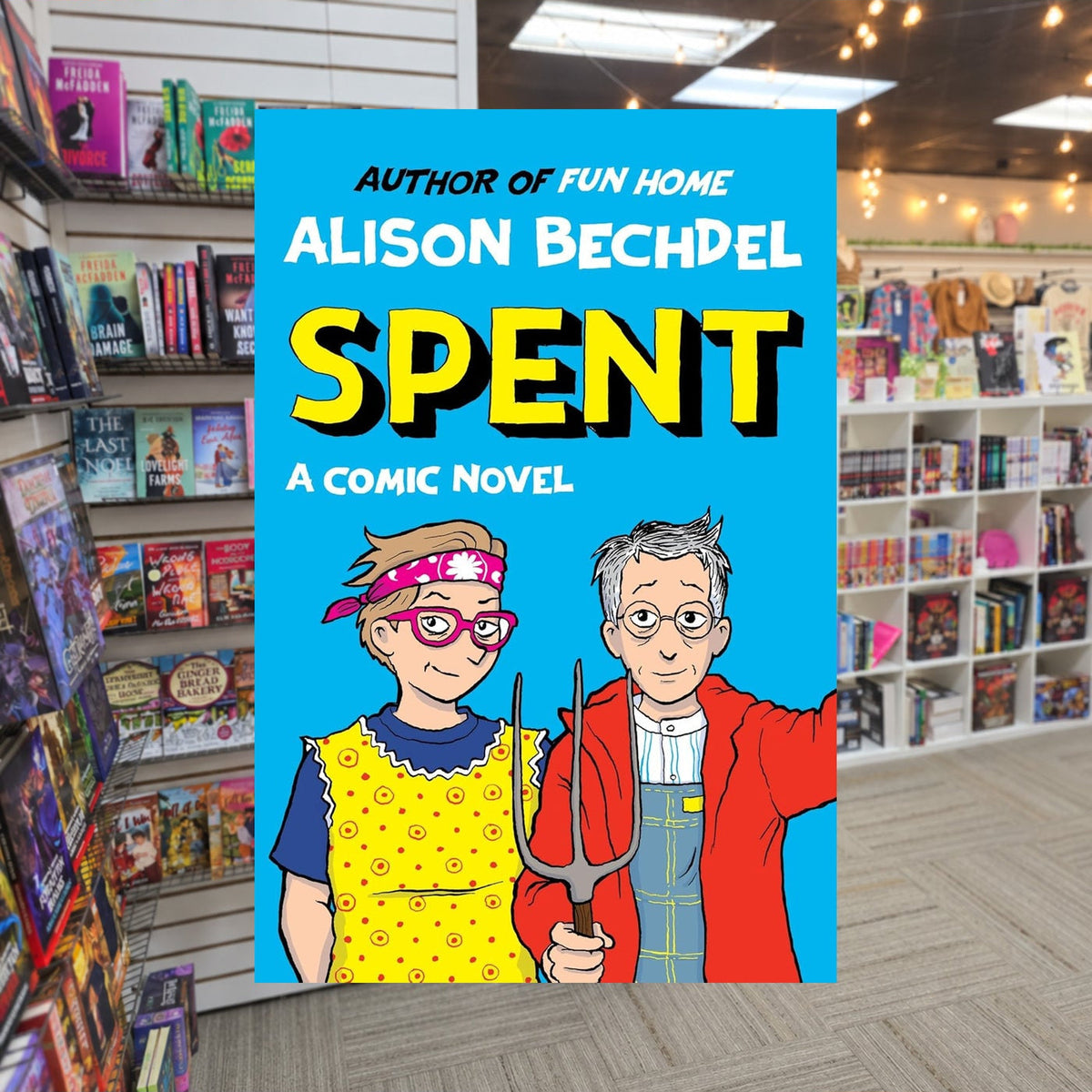 Spent: A Comic Novel by Alison Bechdel — actual cover on The Perk bookstore background