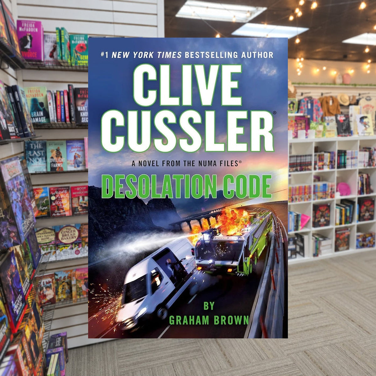 NUMA Files #21: Desolation Code by Graham Brown, Clive Cussler (Series Creator) — actual cover on The Perk bookstore background