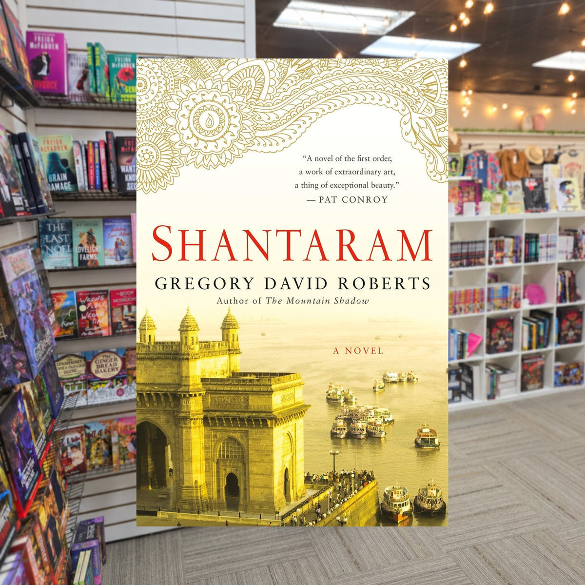 Shantaram #1: Shantaram by Gregory David Roberts — actual cover on The Perk bookstore background