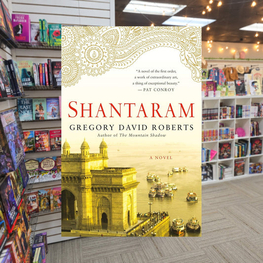 Shantaram #1: Shantaram by Gregory David Roberts — actual cover on The Perk bookstore background