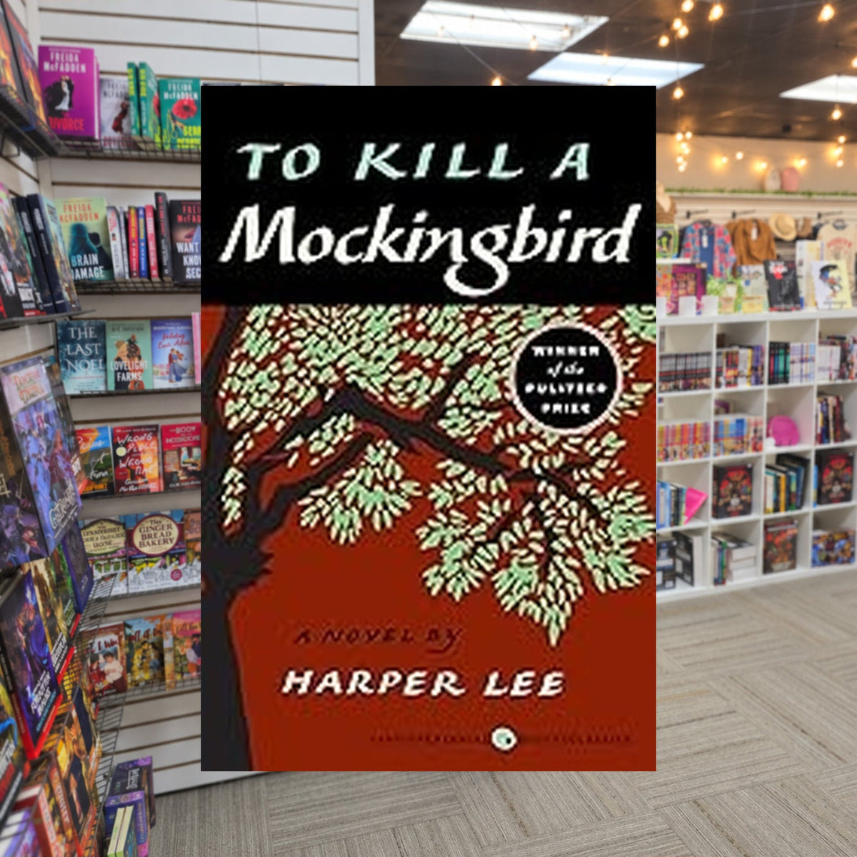 To Kill a Mockingbird #1: To Kill a Mockingbird by Harper Lee — actual cover on The Perk bookstore background