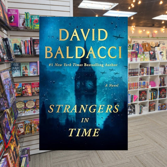 Strangers in Time by David Baldacci — actual cover on The Perk bookstore background
