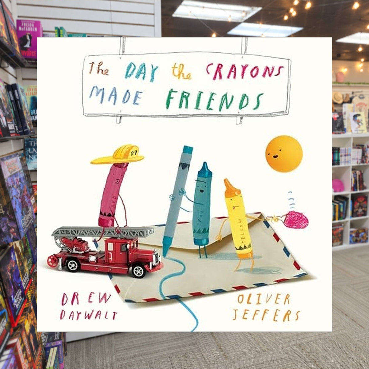 The Day the Crayons Made Friends by Drew Daywalt — actual cover on The Perk bookstore background