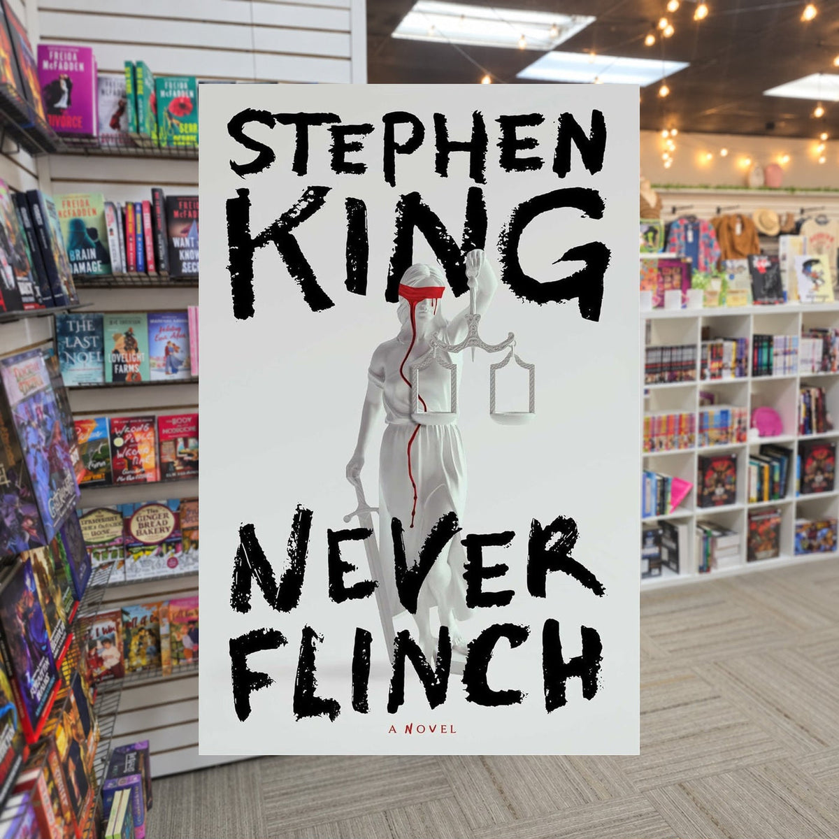Never Flinch by Stephen King — actual cover on The Perk bookstore background