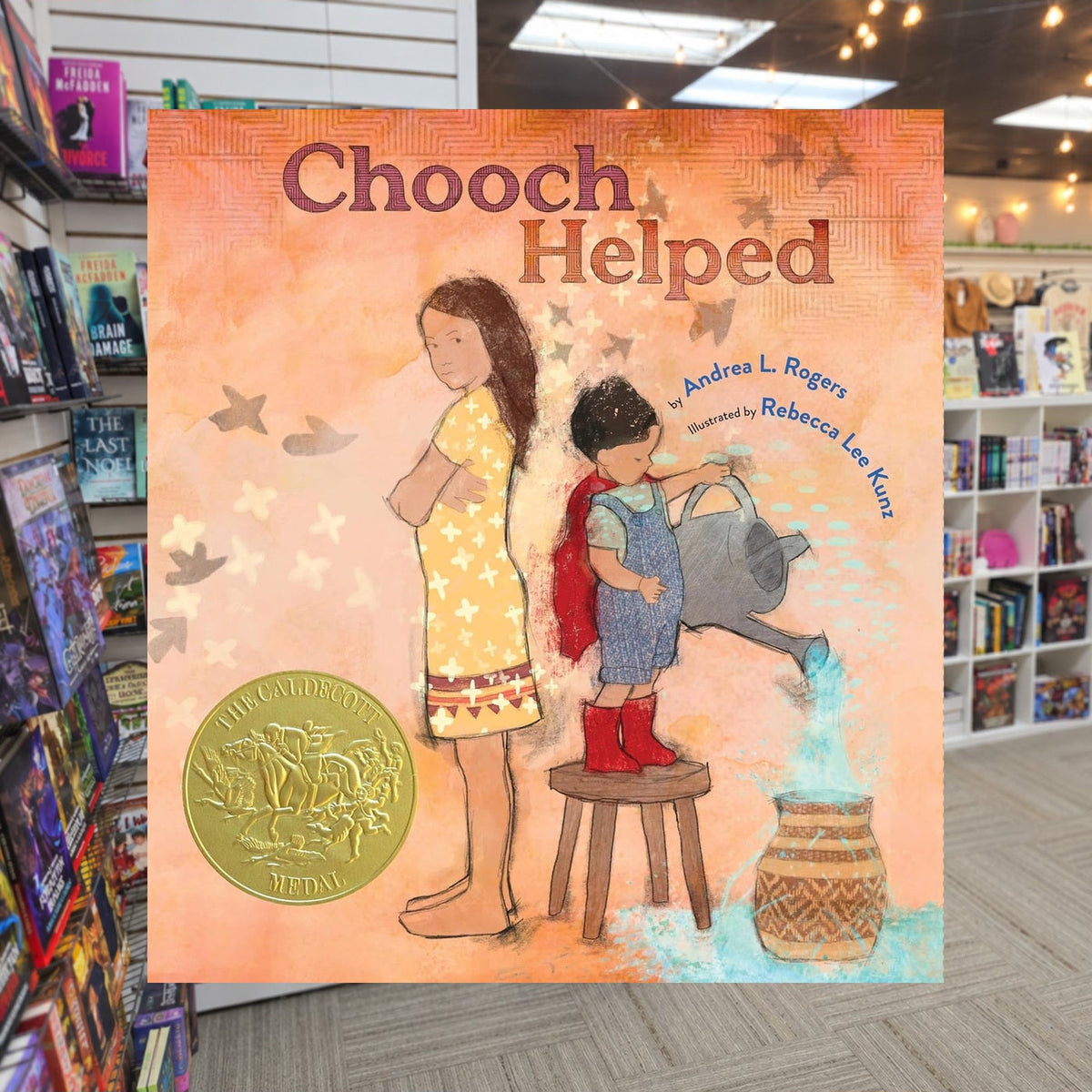 Chooch Helped by Andrea L. Rogers — actual cover on The Perk bookstore background
