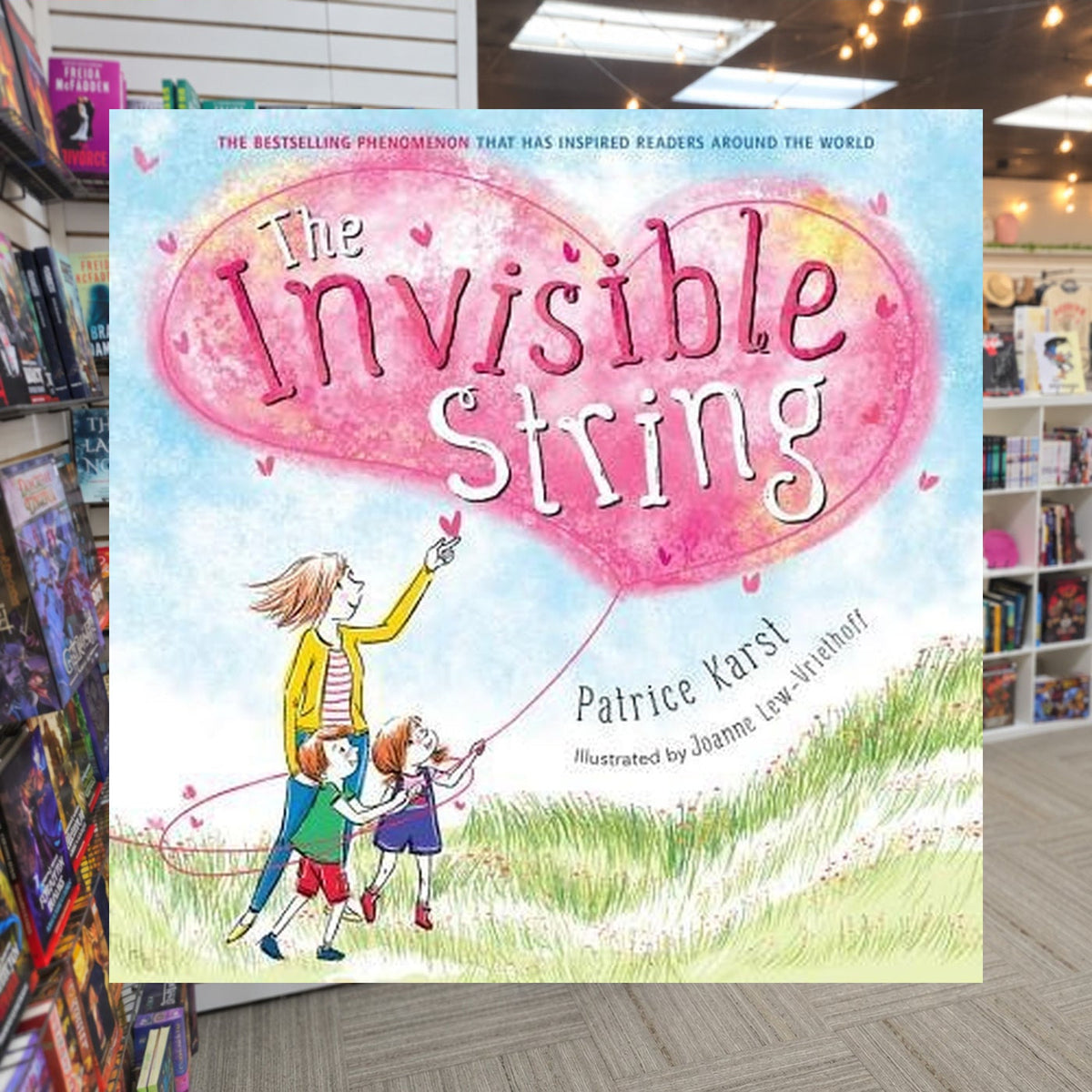 The Invisible String by Patrice Karst — actual cover on The Perk bookstore background
