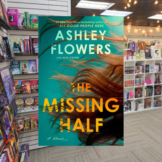 The Missing Half by Ashley Flowers — actual cover on The Perk bookstore background