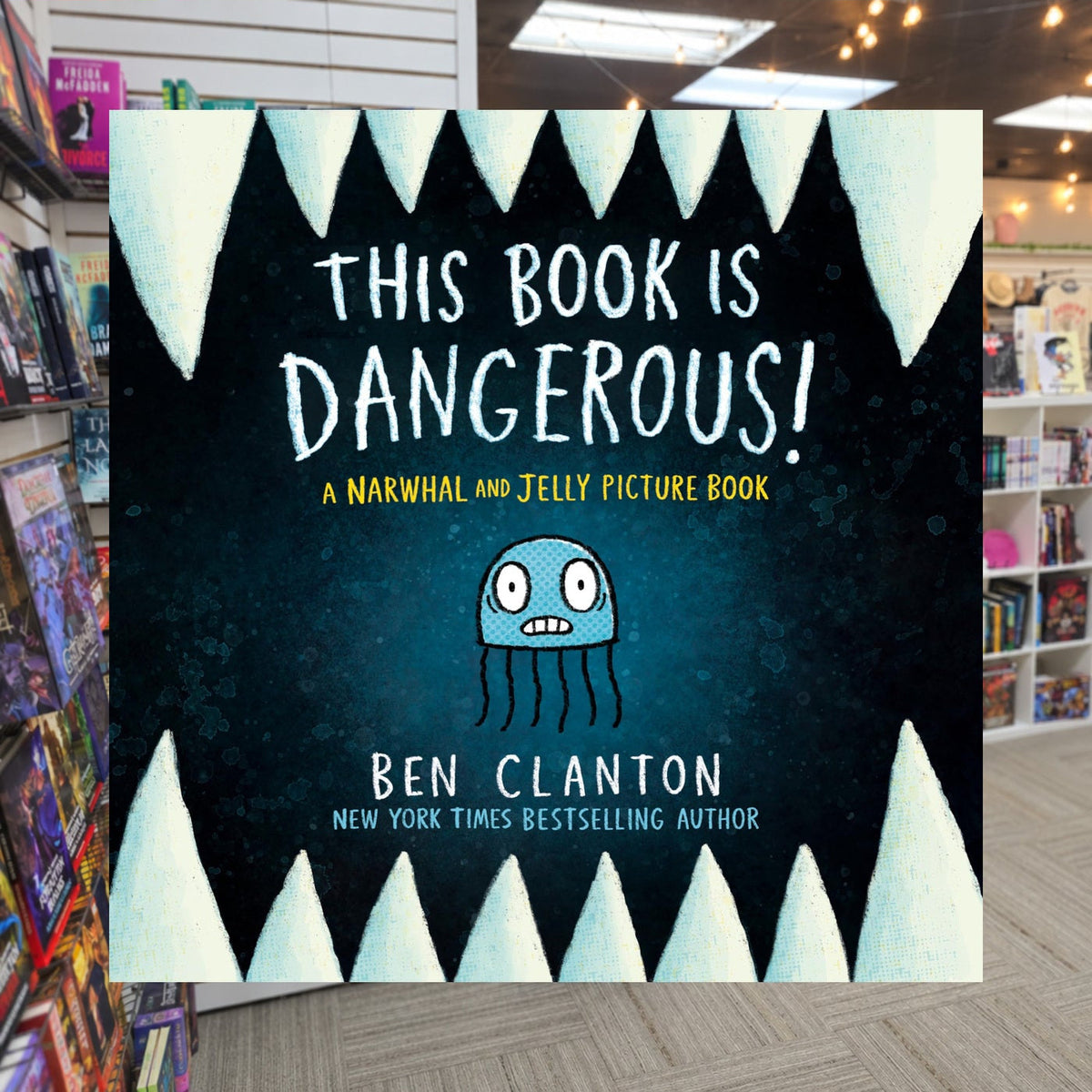 This Book Is Dangerous! by Ben Clanton — actual cover on The Perk bookstore background