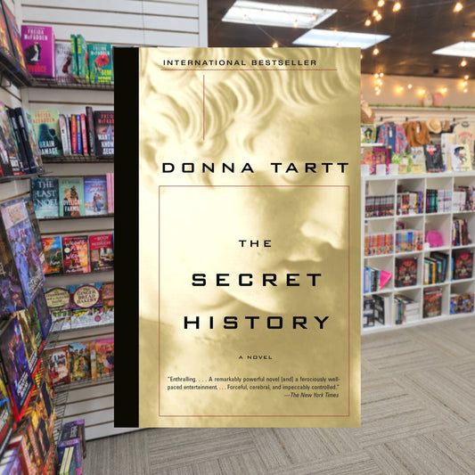 The Secret History by Donna Tartt — actual cover on The Perk bookstore background