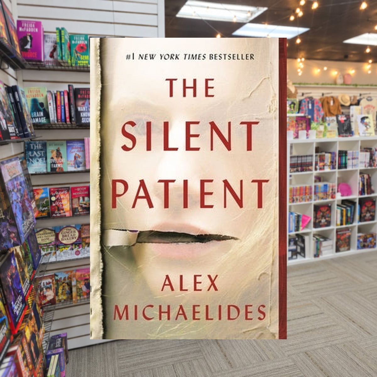 The Silent Patient by Alex Michaelides — actual cover on The Perk bookstore background