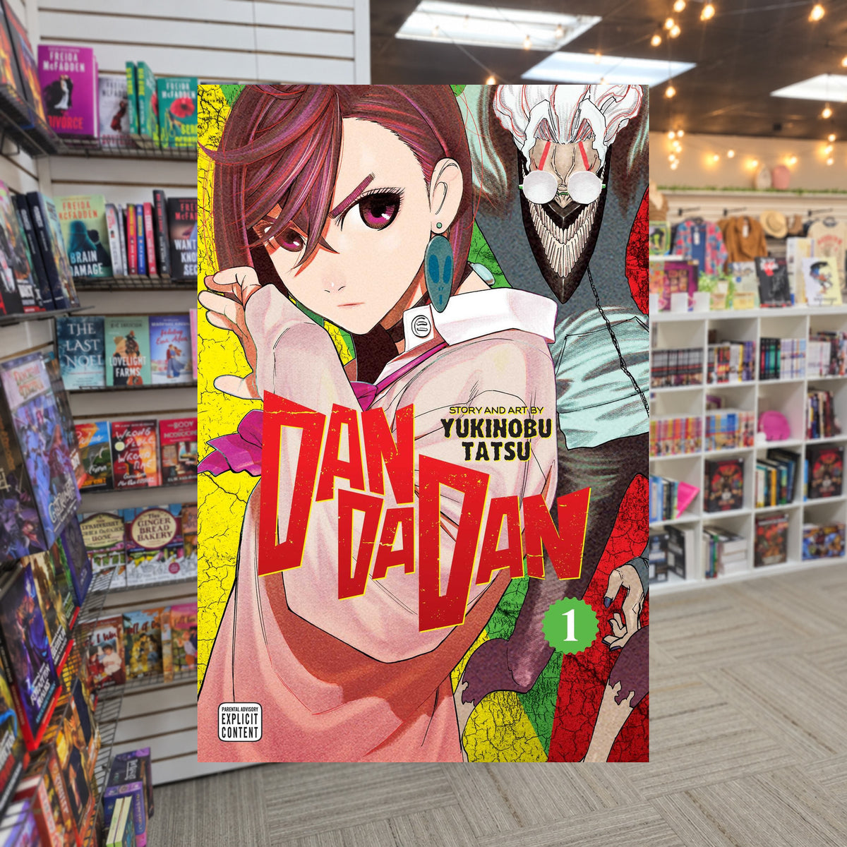 Dandadan, Vol. 1 by Yukinobu Tatsu — actual cover on The Perk bookstore background