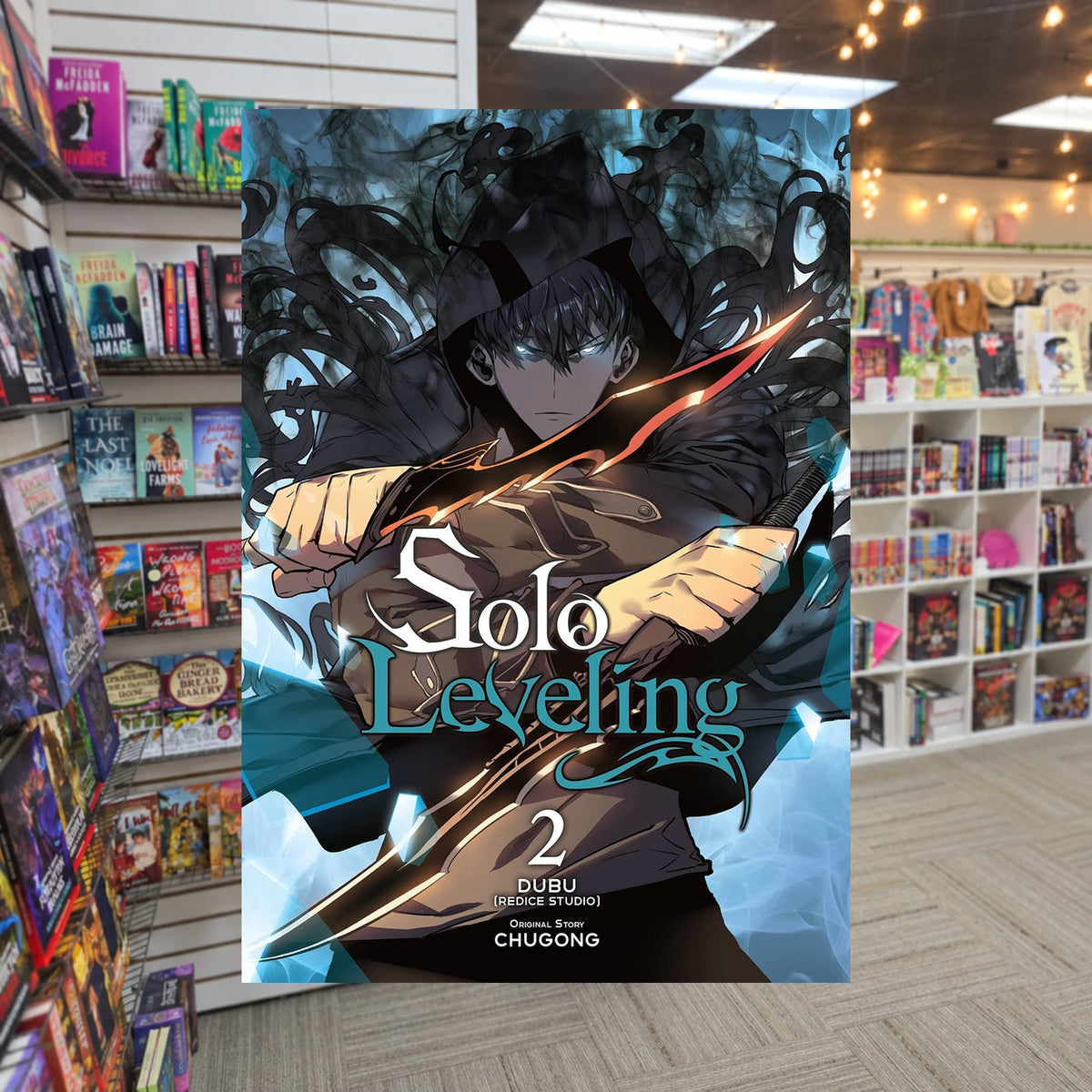 Solo Leveling, Vol. 2 by Chugong — actual cover on The Perk bookstore background