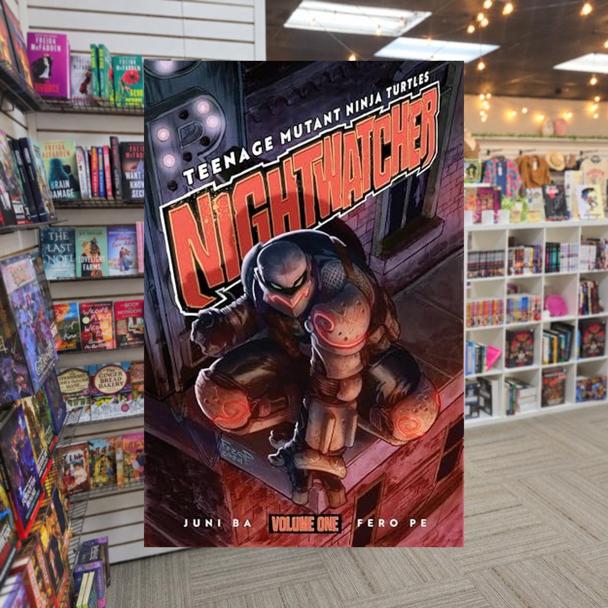 Teenage Mutant Ninja Turtles: Nightwatcher #1-5 Teenage Mutant Ninja Turtles: Nightwatcher Volume 1 by Juni Ba — actual cover on The Perk bookstore background