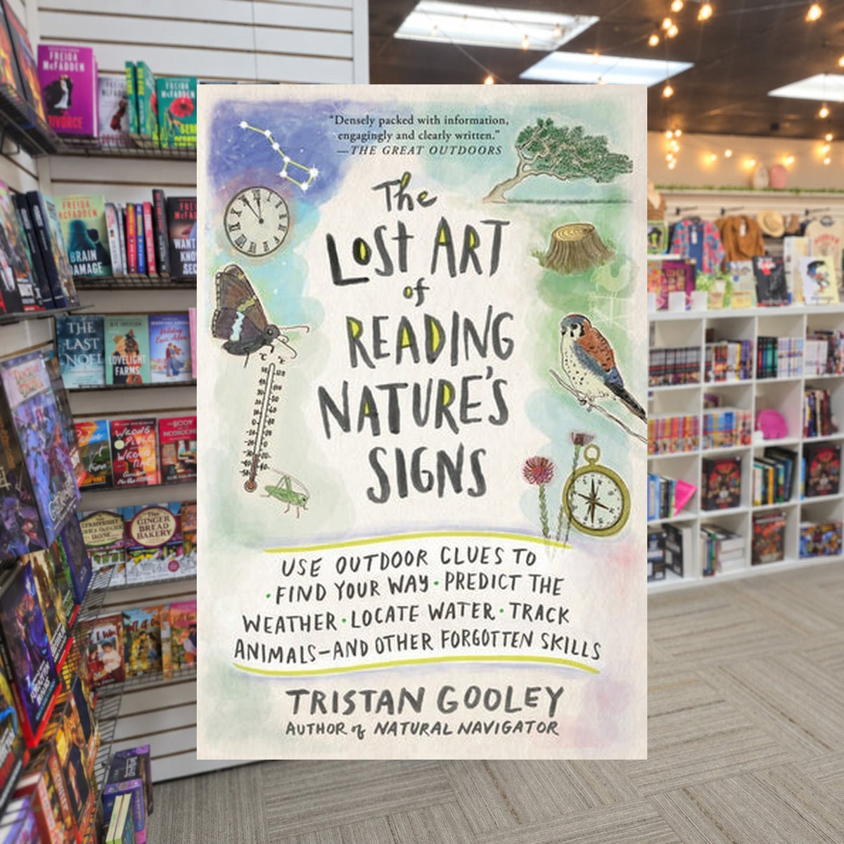 The Lost Art of Reading Nature's Signs by Tristan Gooley — actual cover on The Perk bookstore background