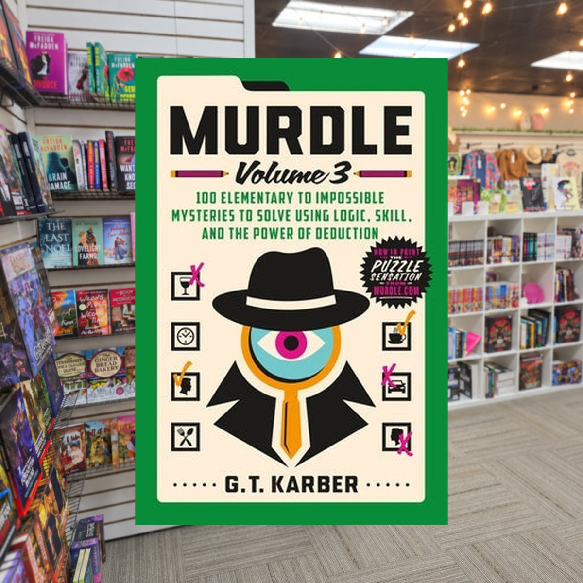 Murdle: Volume 3 — actual cover on The Perk bookstore background