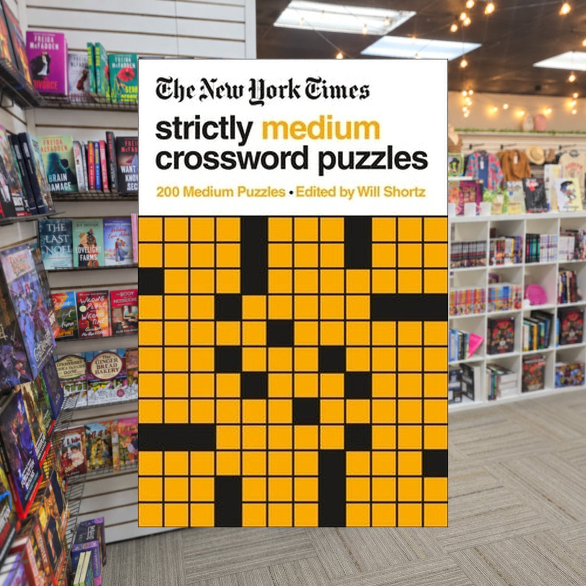 The New York Times Strictly Medium Crossword Puzzles Volume 1 — actual cover on The Perk bookstore background