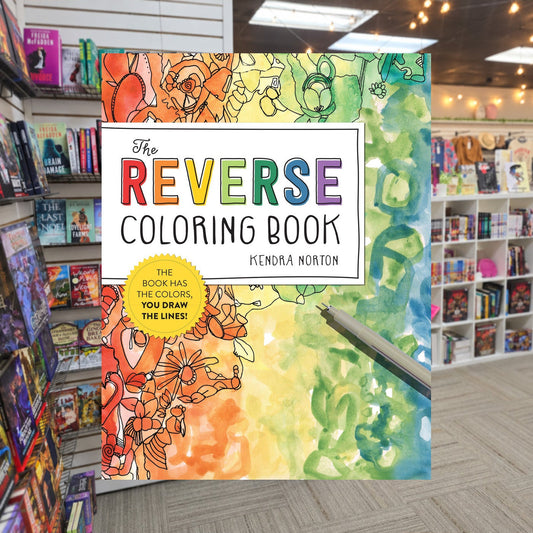 The Reverse Coloring Book by Kendra Norton — actual cover on The Perk bookstore background