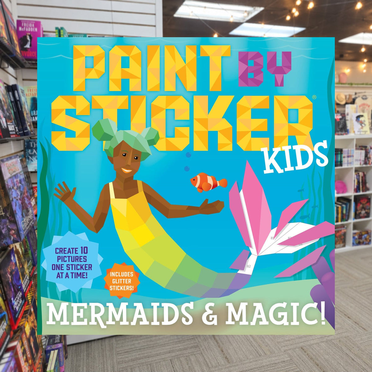 Paint by Sticker Kids: Mermaids & Magic!: Create 10 Pictures One Sticker at a Time! Includes Glitter Stickers by Workman Publishing — actual cover on The Perk bookstore background