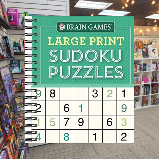 Brain Games LP Sudoku Puzzles by Publications International — actual cover on The Perk bookstore background