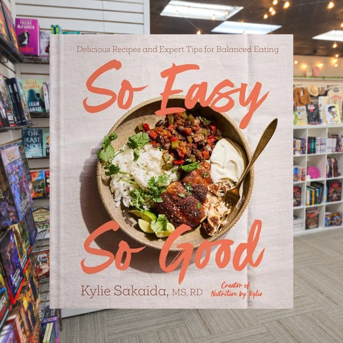 So Easy So Good: Delicious Recipes and Expert Tips for Balanced Eating by Kylie Sakaida — actual cover on The Perk bookstore background