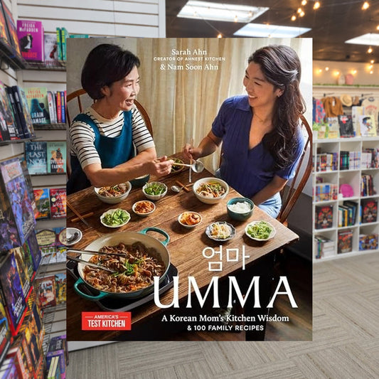 Umma: A Korean Mom's Kitchen Wisdon and 100 Family Recipes by Sarah Ahn — actual cover on The Perk bookstore background