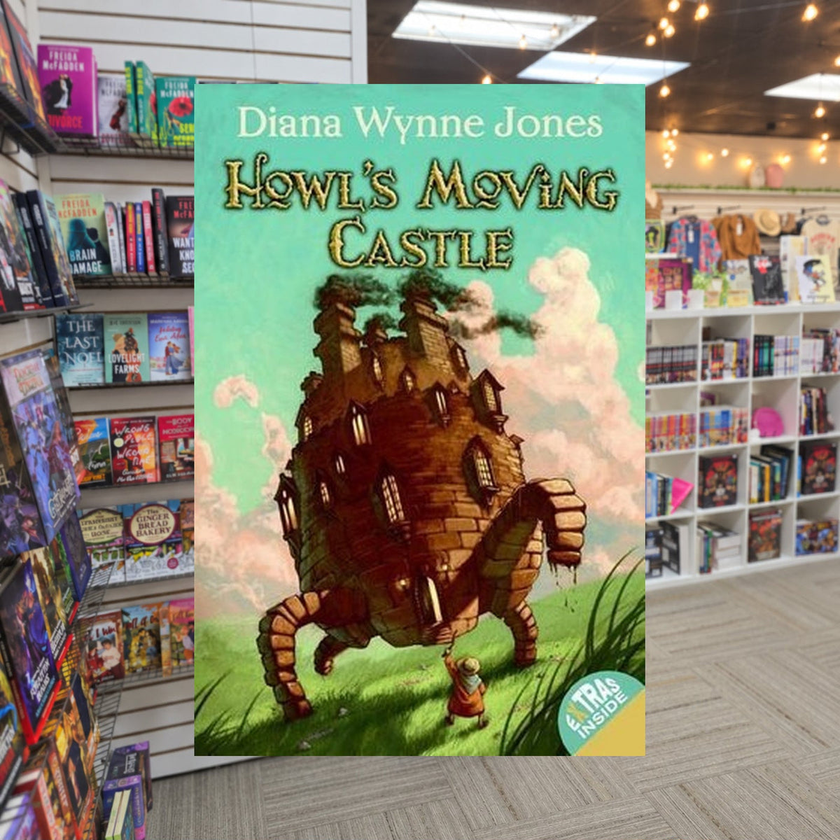 Howl's Moving Castle by Diana Wynne Jones — actual cover on The Perk bookstore background