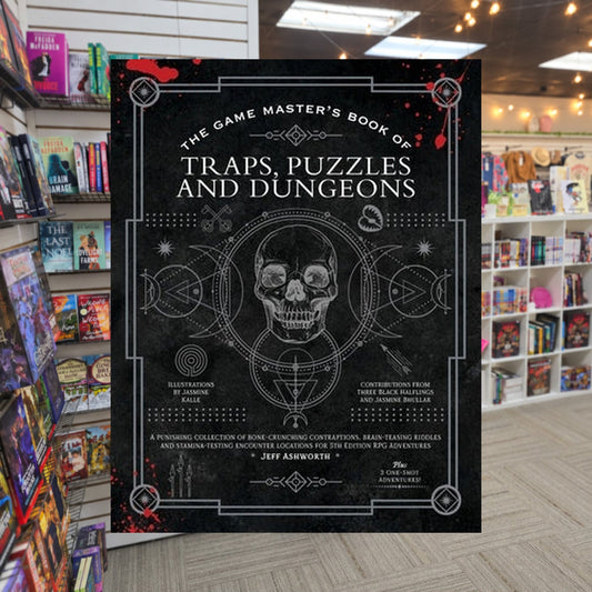 The Game Master's Book of Traps, Puzzles and Dungeons by Jeff Ashworth — actual cover on The Perk bookstore background