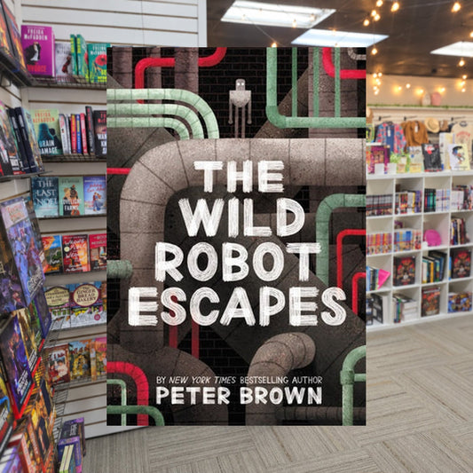 The Wild Robot Escapes by Peter Brown — actual cover on The Perk bookstore background