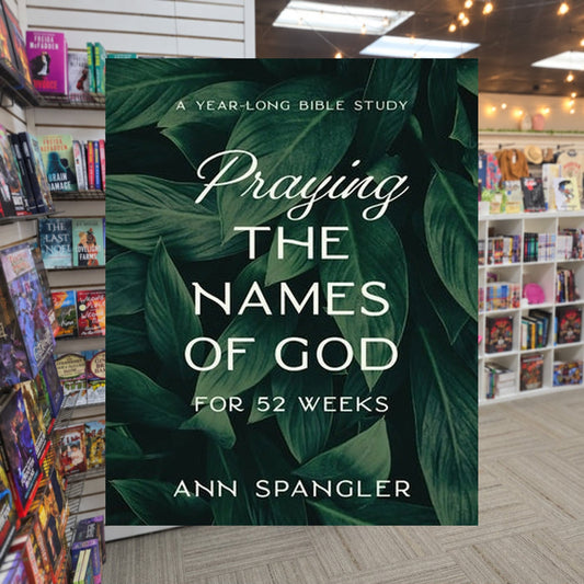 Praying The Names of God for 52 Weeks by Ann Spangler — actual cover on The Perk bookstore background