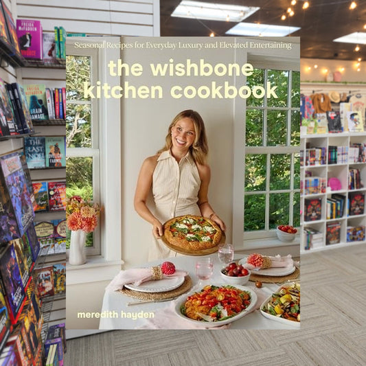 The Wishbone Kitchen Cookbook by Meredith Hayden — actual cover on The Perk bookstore background