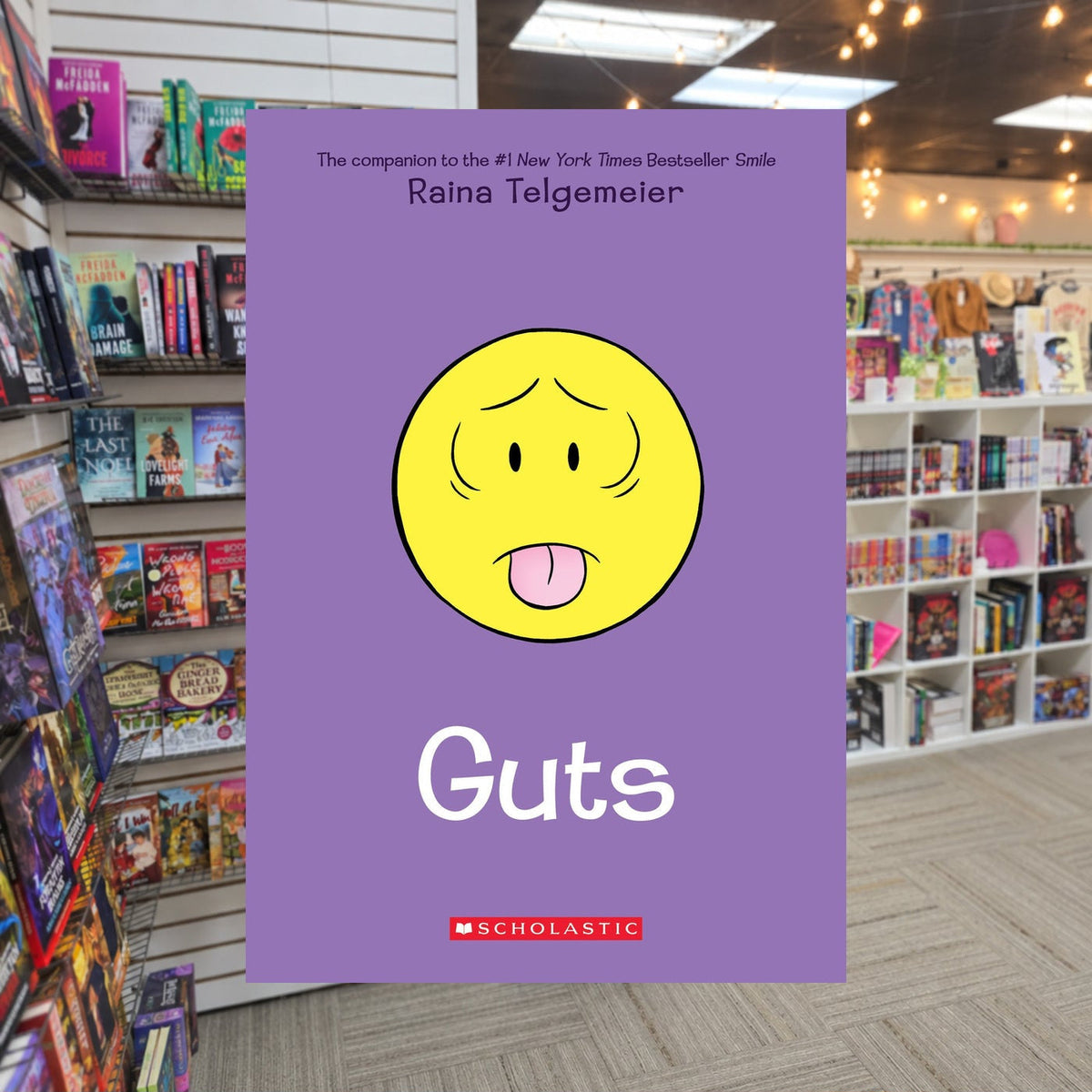 Guts by Raina Telgemeier — actual cover on The Perk bookstore background