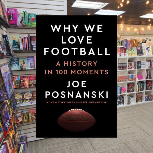 Why We Love Football: A History in 100 Moments — actual cover on The Perk bookstore background