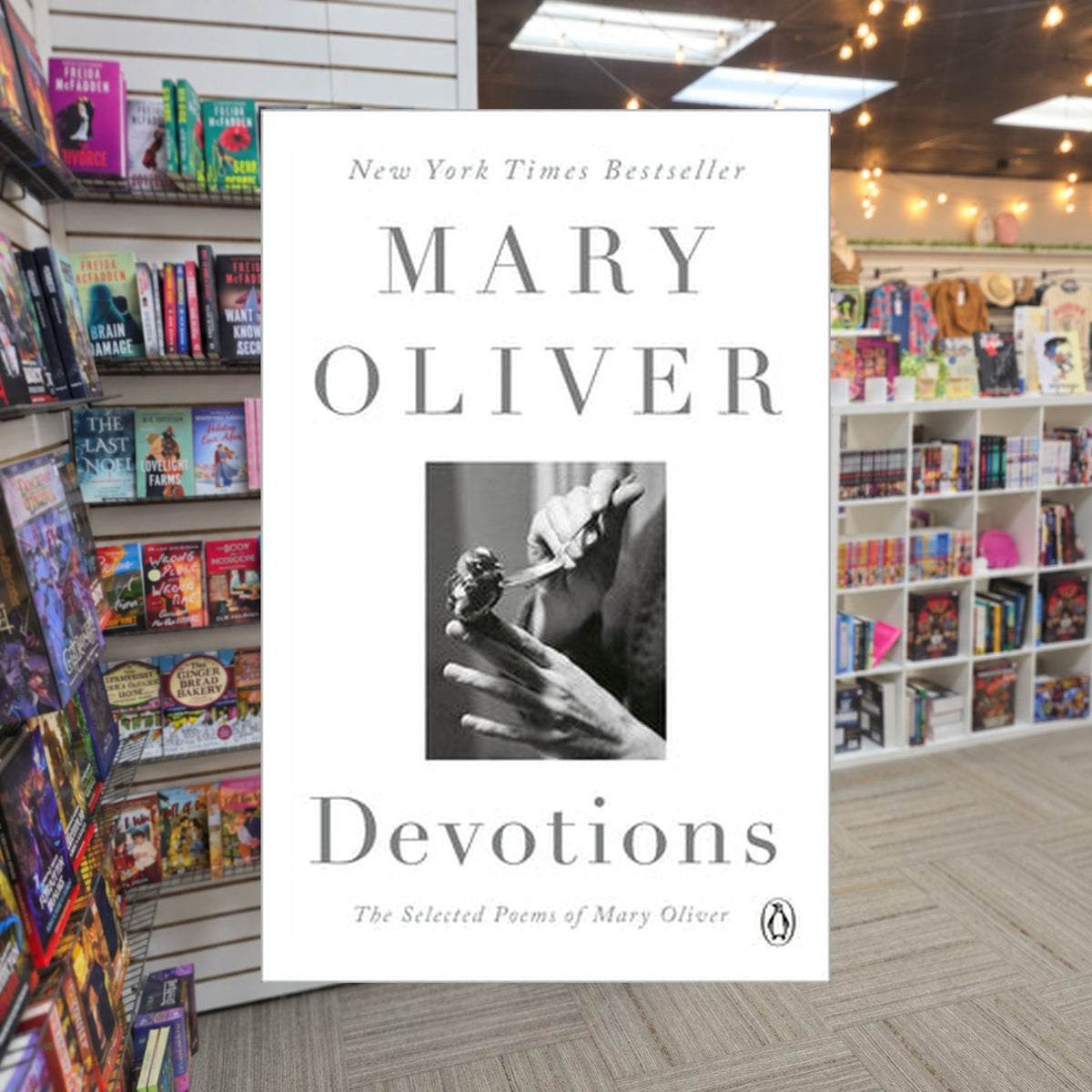 Devotions: The Selected Poems of Mary Oliver by Mary Oliver — actual cover on The Perk bookstore background