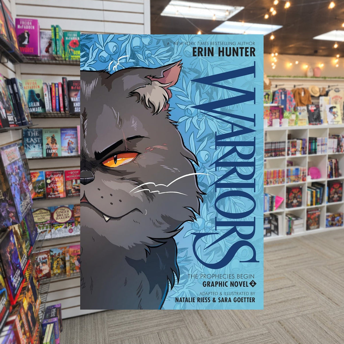 Warriors Graphic Novel: The Prophecies Begin #2 by Erin Hunter — actual cover on The Perk bookstore background