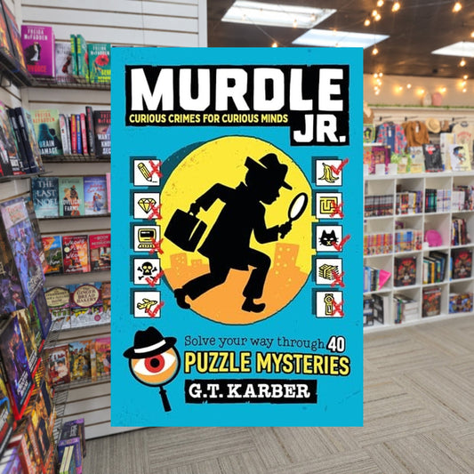 Murdle Jr.: Curious Crimes for Curious Minds: Solve Your Way Through 40 Puzzle Mysteries! by G.T. Karber — actual cover on The Perk bookstore background