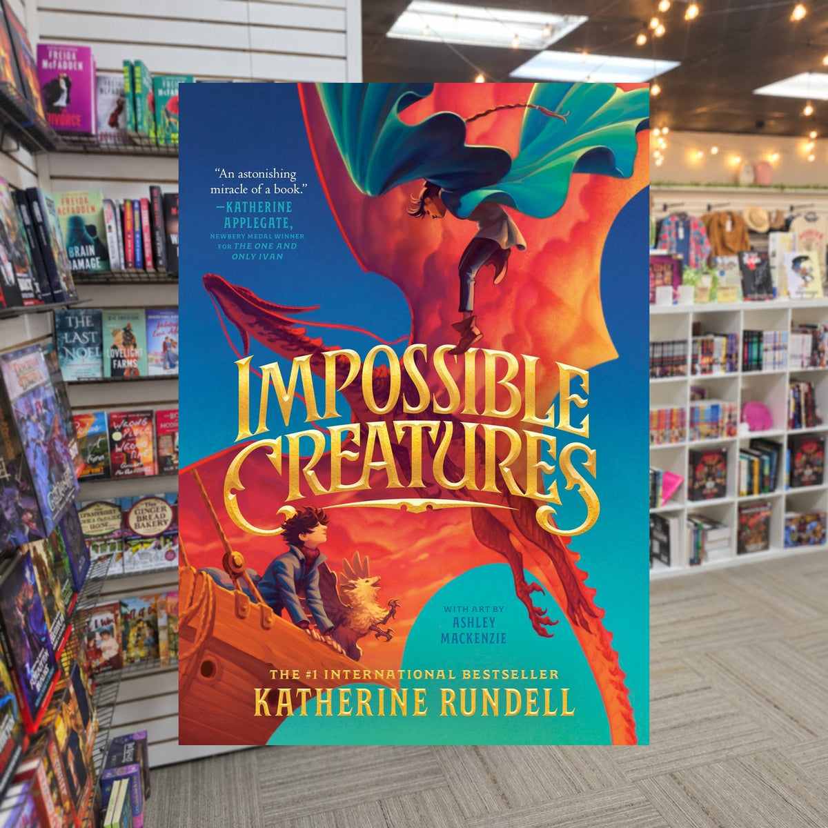 Impossible Creatures by Katherine Rundell — actual cover on The Perk bookstore background